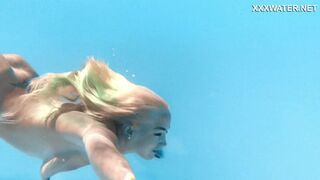 Her tantalizing tiny tits tantalize below, enthralling the dude in the depths