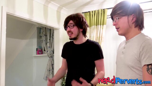 Curvy slut blowing two nerd producers dicks