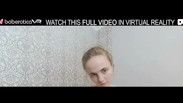 Single brunette with large breasts enjoys solo VR session using a vibrator on the couch